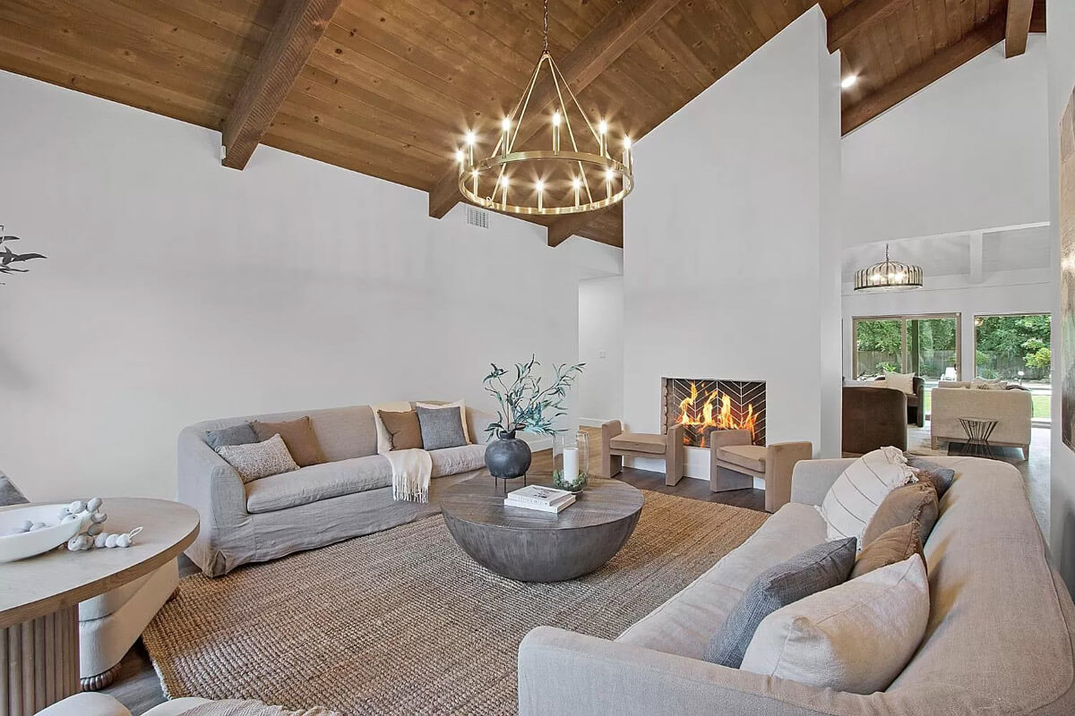 A cozy living room with a fireplace and comfortable couches, perfect for relaxation and warmth.